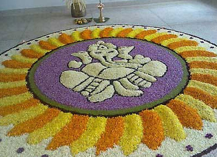 ganpati_rangoli_with_flowers-best-ganesh-rangoli-design-ganpati-bappa-morya