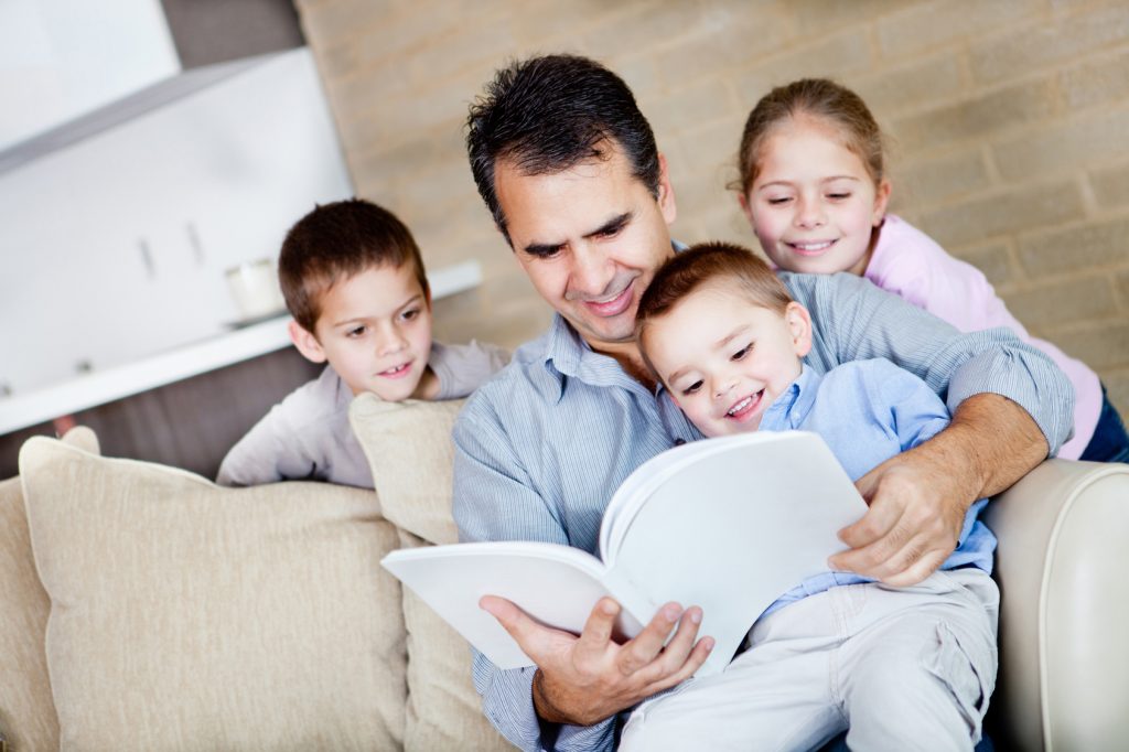 Father reading to children